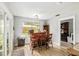 Cozy bar area featuring wooden bar, stools, and a large window overlooking the backyard at 1841 Ne 38Th St, Ocala, FL 34479