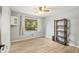 Bright bedroom with hardwood floors, a large window with a view, and simple decor at 1841 Ne 38Th St, Ocala, FL 34479
