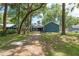 View of home exterior with mature trees surrounding the property at 1841 Ne 38Th St, Ocala, FL 34479