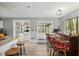 Kitchen view that features granite countertops, bar seating, and view to the living room and patio at 1841 Ne 38Th St, Ocala, FL 34479