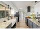 Spacious kitchen features granite countertops, stainless steel appliances, and backyard view at 1841 Ne 38Th St, Ocala, FL 34479