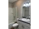 Bathroom showcasing a bathtub with shower, toilet, and vanity with a sink at 185 Malauka Loop, Ocklawaha, FL 32179