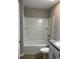 Bathroom showcasing a bathtub with shower, toilet, and vanity with a sink at 185 Malauka Loop, Ocklawaha, FL 32179