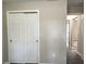 Bedroom closet featuring sliding doors in a room with neutral walls and carpet flooring at 185 Malauka Loop, Ocklawaha, FL 32179