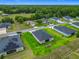A lovely community shown from above, featuring houses with large yards and mature trees at 19424 Sw 77Th Loop, Dunnellon, FL 34432