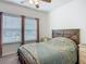 Comfortable bedroom with lots of light from windows and unique wooden headboard at 19424 Sw 77Th Loop, Dunnellon, FL 34432