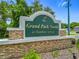 Entrance sign for Grand Park North at Rainbow Springs, with stone base and landscaping at 19424 Sw 77Th Loop, Dunnellon, FL 34432