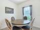 Cozy dining area features modern furnishings and natural light from the nearby window at 19424 Sw 77Th Loop, Dunnellon, FL 34432