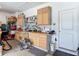 Organized garage workshop area with cabinets, pegboards, and a workbench for DIY projects and storage at 19424 Sw 77Th Loop, Dunnellon, FL 34432
