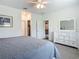 Bright main bedroom featuring neutral walls, and a view into the living area at 19424 Sw 77Th Loop, Dunnellon, FL 34432