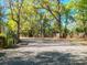 Gravel parking area surrounded by trees and foliage at a community park at 19424 Sw 77Th Loop, Dunnellon, FL 34432