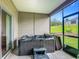 Relaxing screened patio featuring hot tub and views of the backyard, perfect for outdoor enjoyment and privacy at 19424 Sw 77Th Loop, Dunnellon, FL 34432