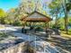 Community picnic area with tables, grills and walkway at 19424 Sw 77Th Loop, Dunnellon, FL 34432