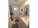 Cozy bathroom featuring a vanity, mirror, toilet, tub, and shower at 2131 Ne 145Th Avenue Rd, Silver Springs, FL 34488