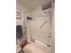 Bathroom interior showcases a bathtub, tiled shower, and shower head at 2131 Ne 145Th Avenue Rd, Silver Springs, FL 34488
