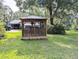 Gazebo on a lush lot, perfect for enjoying the outdoors with friends at 2131 Ne 145Th Avenue Rd, Silver Springs, FL 34488