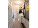 Utility room with washer, dryer, and a well-organized storage shelf at 2131 Ne 145Th Avenue Rd, Silver Springs, FL 34488