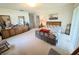 Spacious main bedroom features carpet, a light wooden dresser and artwork at 2131 Ne 145Th Avenue Rd, Silver Springs, FL 34488