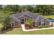 Expansive aerial view of a charming single story home with lush greenery and landscaping at 2151 Se 59Th St, Ocala, FL 34480