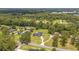 Panoramic aerial shot of suburban homes nestled among trees near a cemetery at 2151 Se 59Th St, Ocala, FL 34480