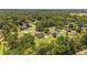 Expansive aerial view showcasing the property's large lot, surrounding trees, and neighborhood at 2151 Se 59Th St, Ocala, FL 34480