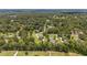 An aerial view showing multiple houses nestled within a lush, green landscape at 2151 Se 59Th St, Ocala, FL 34480