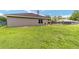 Lush backyard with a glimpse of the house, pool, and neighboring properties at 2151 Se 59Th St, Ocala, FL 34480