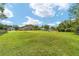 Spacious backyard showing the house and surrounding properties at 2151 Se 59Th St, Ocala, FL 34480