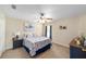 A cozy bedroom with carpet, ceiling fan, and a window to let in plenty of natural light at 2151 Se 59Th St, Ocala, FL 34480