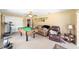 Spacious bonus room with pool table, seating area, and neutral carpeting at 2151 Se 59Th St, Ocala, FL 34480