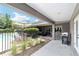 Spacious outdoor patio with pool access, complete with grill and shaded dining, perfect for entertaining at 2151 Se 59Th St, Ocala, FL 34480