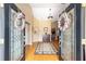 Inviting foyer with hardwood floors, elegant decor, and a view into the dining room at 2151 Se 59Th St, Ocala, FL 34480
