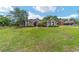 Beautiful home with a large front lawn, stone accents, and a welcoming entrance at 2151 Se 59Th St, Ocala, FL 34480