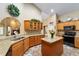 Well-lit kitchen features granite countertops, an island, and light wood cabinets for a great cooking space at 2151 Se 59Th St, Ocala, FL 34480
