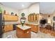 Well-equipped kitchen with granite countertops, wooden cabinets, and modern appliances at 2151 Se 59Th St, Ocala, FL 34480