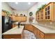Stylish kitchen with island, granite counters, and wood cabinetry offers both beauty and functionality at 2151 Se 59Th St, Ocala, FL 34480