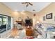 Spacious living room featuring hardwood floors, a fireplace, and ample seating at 2151 Se 59Th St, Ocala, FL 34480