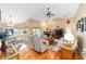 Open living room with hardwood floors, vaulted ceiling, and fireplace at 2151 Se 59Th St, Ocala, FL 34480