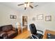 Inviting home office space with a leather chair and view into the hallway at 2151 Se 59Th St, Ocala, FL 34480