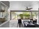 Relaxing covered patio with fan and outdoor seating is great for entertaining and enjoying the outdoors at 2151 Se 59Th St, Ocala, FL 34480