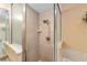 Tiled shower with glass doors, built-in soap dish, and attractive tile work at 2151 Se 59Th St, Ocala, FL 34480