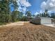 Exterior view of the home, featuring an attached two-car garage at 23213 Nw Mallard Ave, Dunnellon, FL 34431