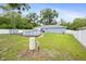 Expansive fenced backyard featuring a large above-ground swimming pool, perfect for outdoor entertaining at 2924 Se 142Nd Pl, Summerfield, FL 34491