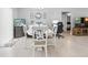 Spacious dining area with a modern table setup, open to other living areas at 2924 Se 142Nd Pl, Summerfield, FL 34491