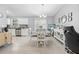 Inviting dining area features a stylish light fixture, view to the kitchen and neutral colors at 2924 Se 142Nd Pl, Summerfield, FL 34491