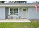 Cozy front porch with rocking chairs, perfect for relaxing and enjoying the outdoors at 2924 Se 142Nd Pl, Summerfield, FL 34491