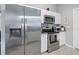 Modern kitchen featuring stainless steel appliances and white cabinets at 2924 Se 142Nd Pl, Summerfield, FL 34491