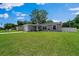 Picture of single-story home with an attached garage and well-maintained lawn at 3094 Se 144Th Pl, Summerfield, FL 34491