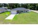 Beautiful gray home features a well-kept lawn, paved driveway, and inviting curb appeal at 3094 Se 144Th Pl, Summerfield, FL 34491