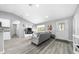 Bright, open-concept living space featuring modern furniture, stylish decor, and hardwood flooring throughout at 3094 Se 144Th Pl, Summerfield, FL 34491